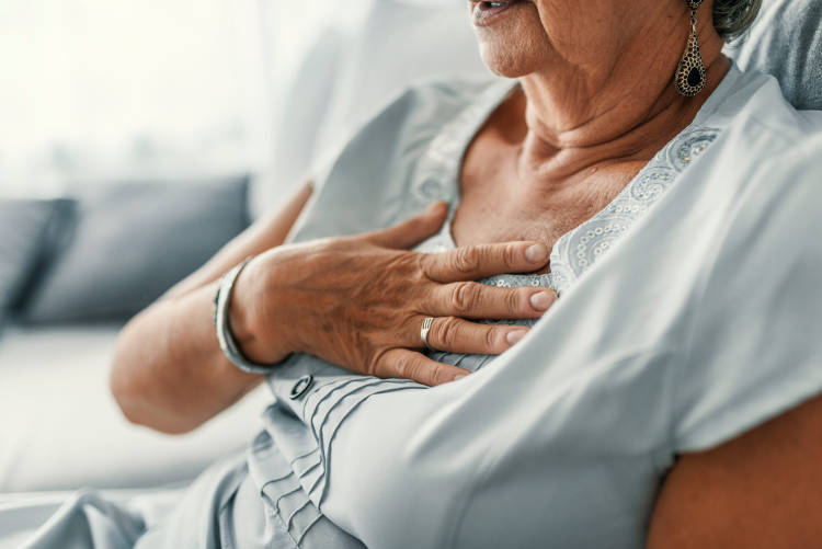 Aged woman suffering from GORD or Gastro-Oesophageal Reflux Disease